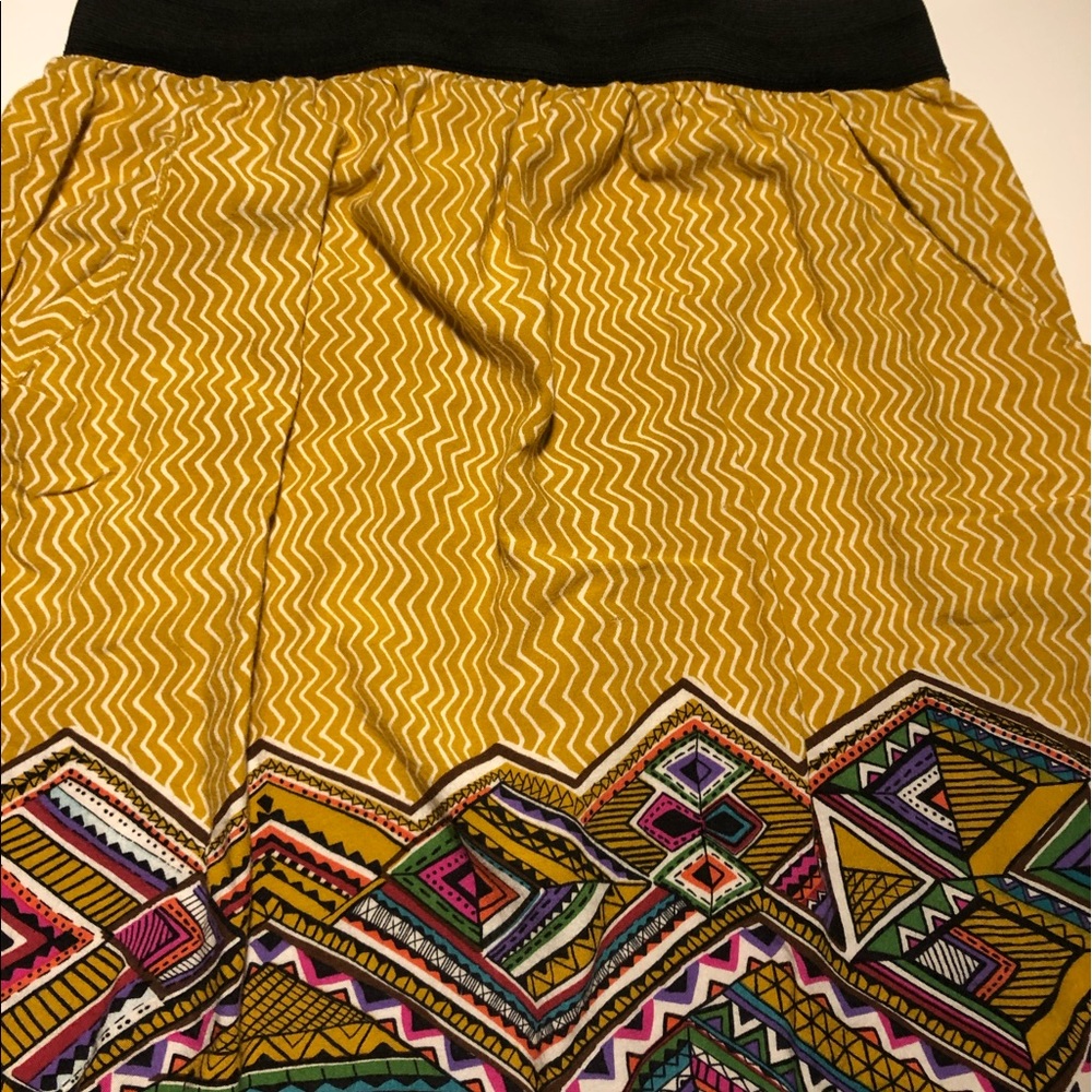 Yellow skirt with multi colored design on bottom